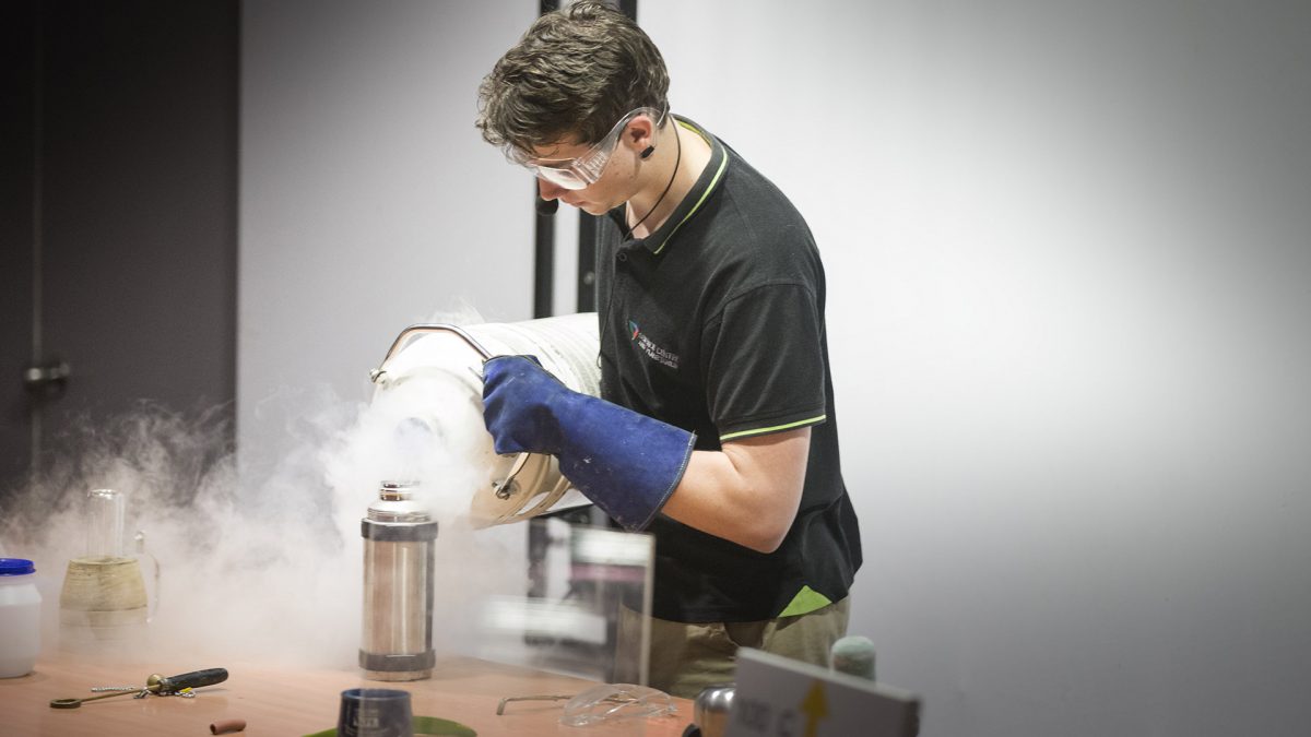 Man in protective gear experimenting with Liquid Nitrogen