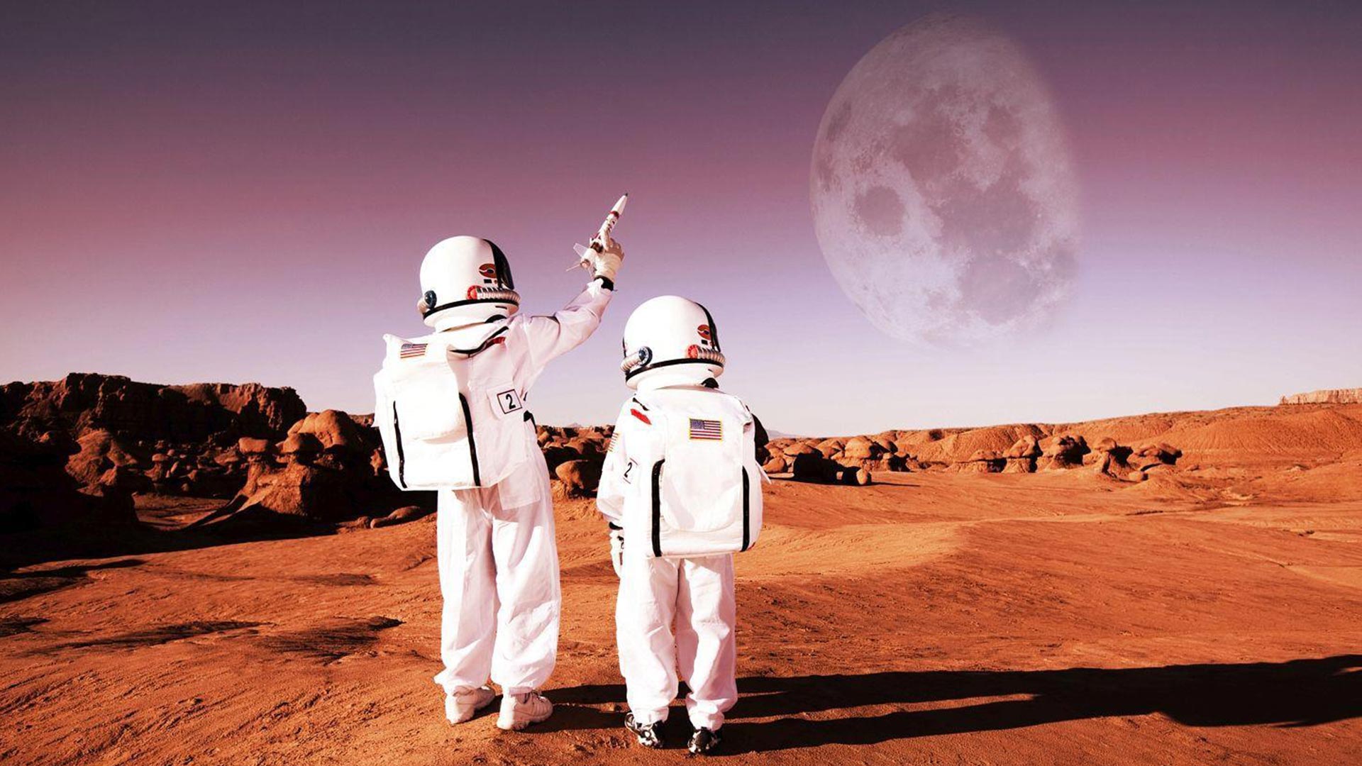 two astronaughts walking on a dry, red planet with the moon in the background