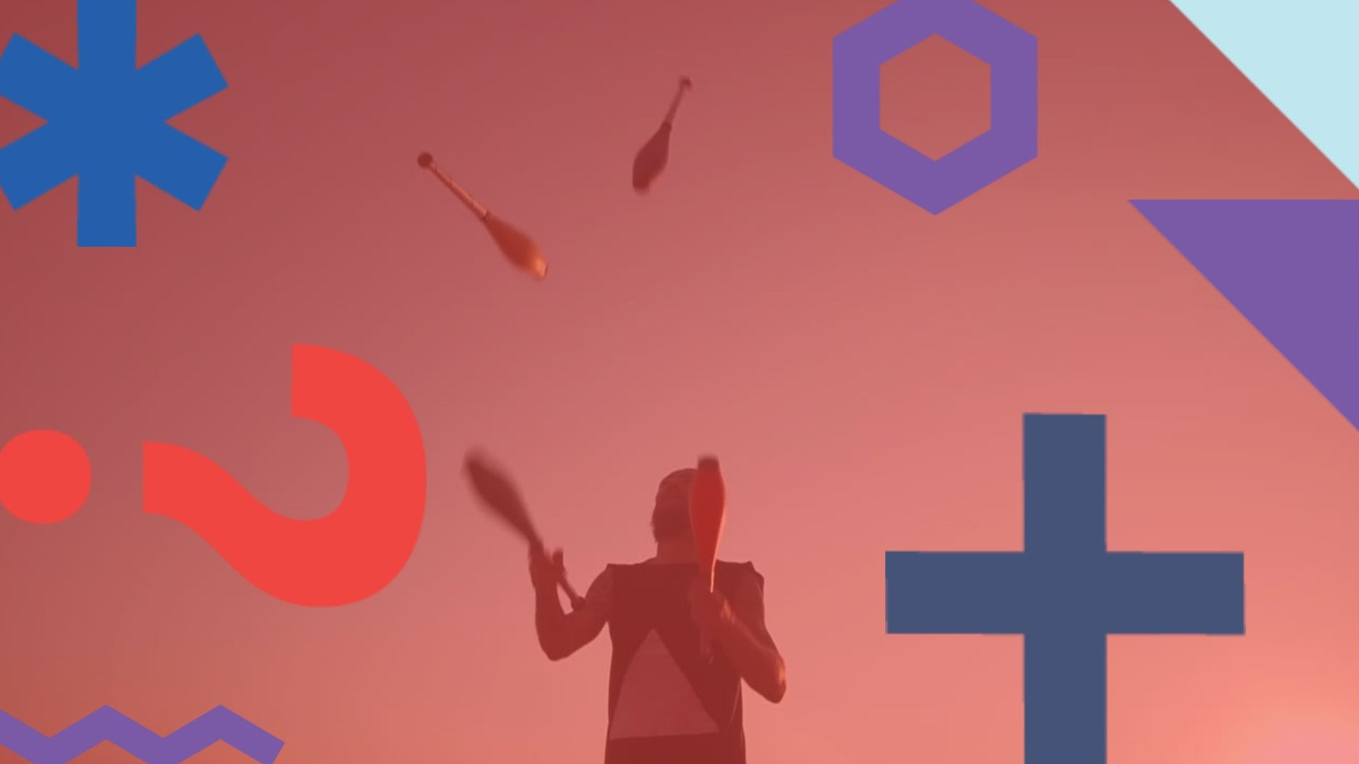Silhouette of man juggling with clubs